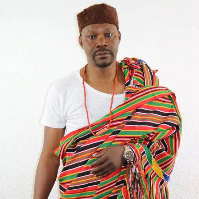 Author writing books in a library setting